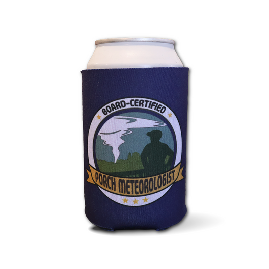 A navy blue can cooler sleeve on a white can, featuring a circular 'Board-Certified Porch Meteorologist' graphic with a tornado illustration and a silhouetted figure.